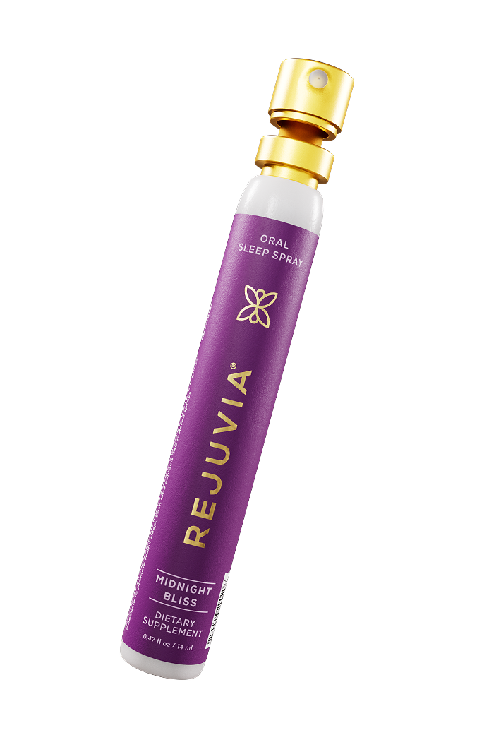 Purple REJUVIA oral sleep spray bottle on a white background