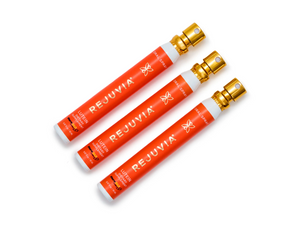 Three Rejuvia oral lutein dietary supplement spray on a white background
