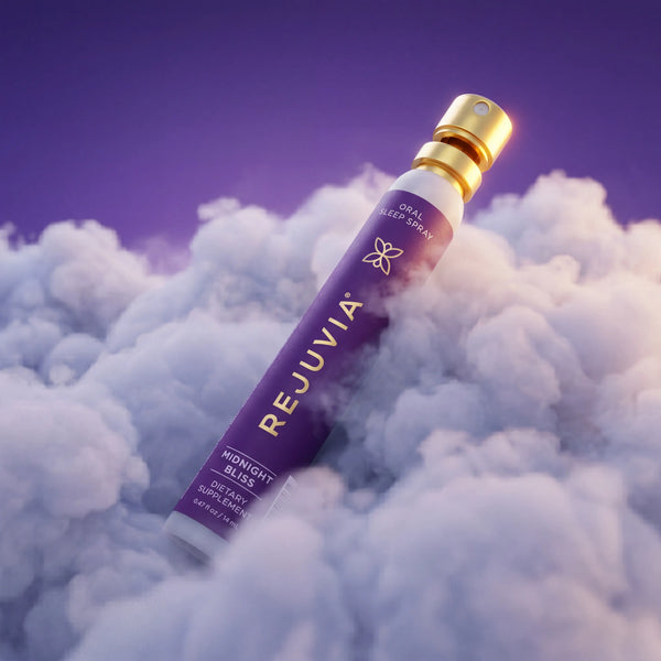 REJUVIA oral sleep spray bottle on a cloud background