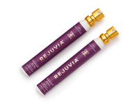 Two purple REJUVIA sleep products with gold caps on a white background